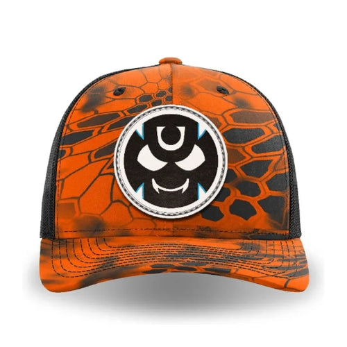 Orange and black Kryptek Inferno trucker cap with a front leather patch featuring the Gutter Brudderz Monster #2 logo.
