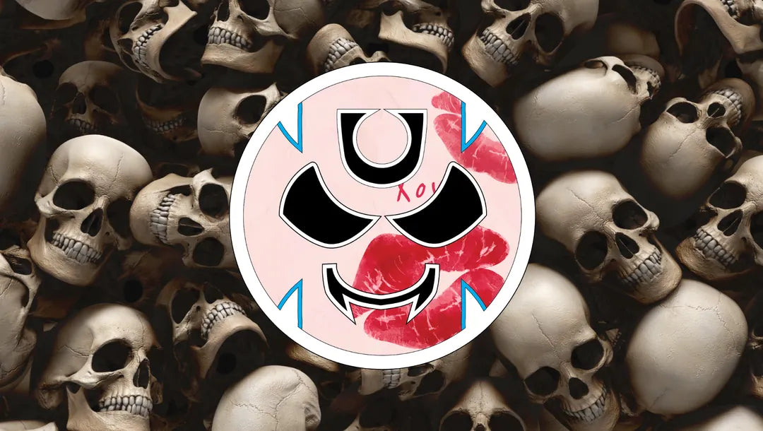 Gutter Brudderz Kissy Face Monster logo displayed over a background of stacked human skulls.