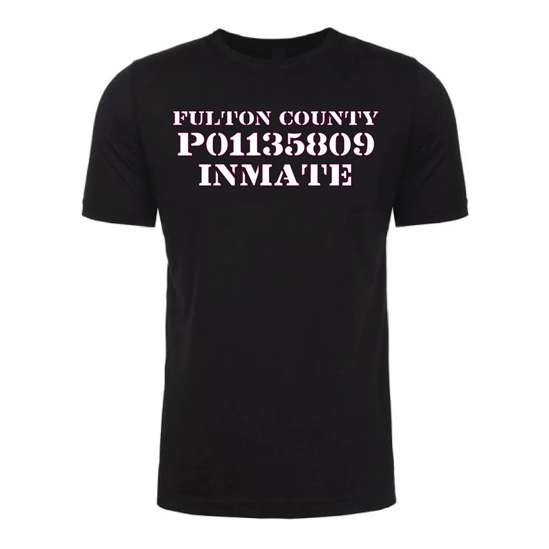 Front view of a black Gutter Brudderz T-shirt featuring ‘The Tourist’ graphic with the text ‘Fulton County P01135809 Inmate.